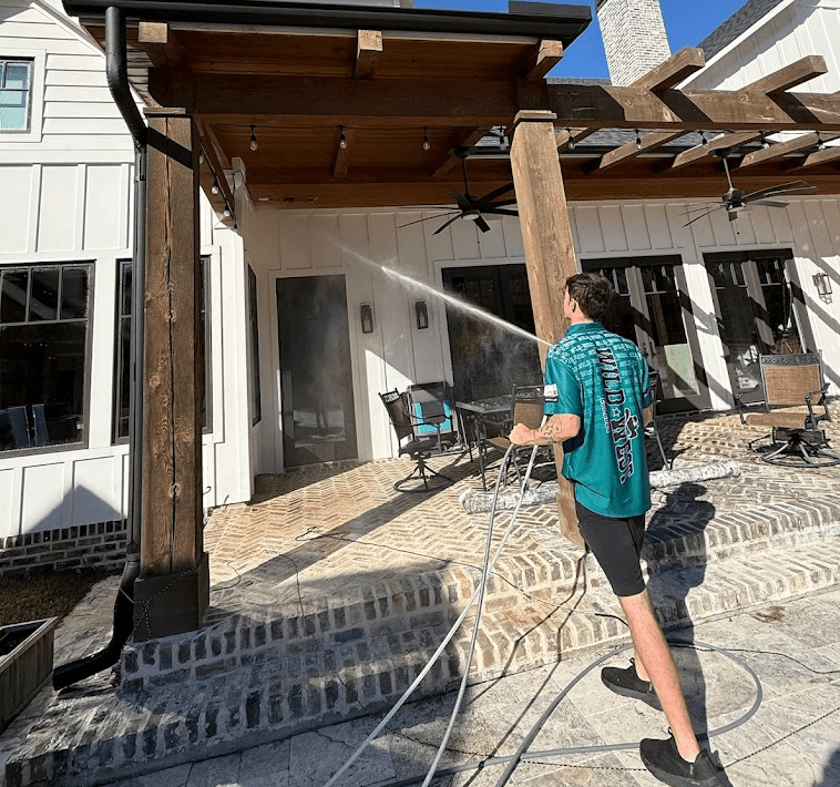 Wild West Window Wash cleaning a covered patio at a Houston home